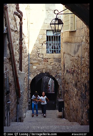 Children on stairs of an old alley. Jerusalem, Israel