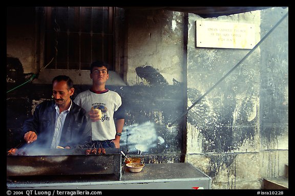 Food vendor broiling meat. Jerusalem, Israel
