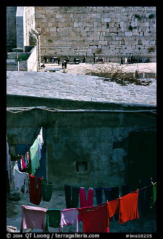 Laundry in a courtyard, with the Western Wall in the background. Jerusalem, Israel (color)