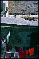 Laundry in a courtyard, with the Western Wall in the background. Jerusalem, Israel