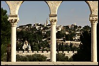 Spires and Mount of Olives seen through arches. Jerusalem, Israel (color)