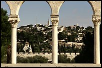 Spires and Mount of Olives seen through arches. Jerusalem, Israel