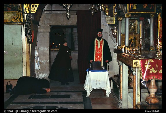Worshiping inside the Church of the Holy Sepulchre. Jerusalem, Israel (color)