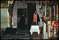Worshiping inside the Church of the Holy Sepulchre. Jerusalem, Israel ( color)