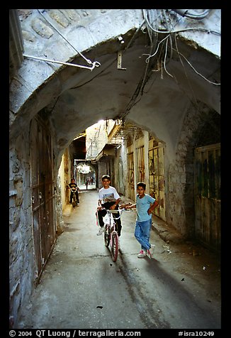 Two children under an archway, Hebron. West Bank, Occupied Territories (Israel) (color)