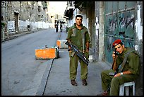 Two young israeli soldiers manning a checkpoint, Hebron. West Bank, Occupied Territories (Israel)