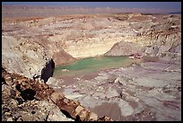 Shallow pond and colored rocks, near Mitzpe Ramon. Negev Desert, Israel