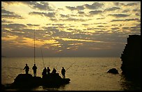 Fishermen standing on a rock, Akko (Acre). Israel ( color)