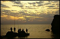 Fishermen standing on a rock, Akko (Acre). Israel (color)