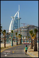 Kids, bike path and Burj Al Arab, Sunset Beach. United Arab Emirates ( color)