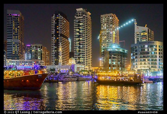 Restaurant boats and Al Rahim Mosque at night. United Arab Emirates (color)