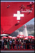Visitors with umbrellas, Swizerland Pavilion. Expo 2020, Dubai, United Arab Emirates ( color)