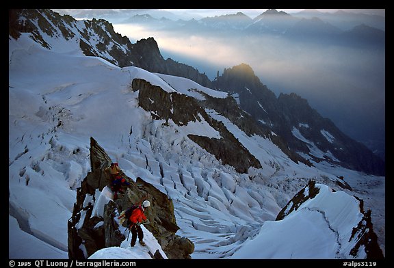 Climbers on the rocky part of the Brenva Spur, Mont-Blanc, Italy.