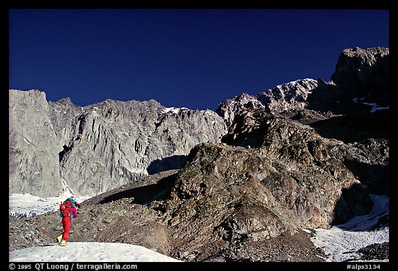 Alpinist approaching the Freney Pillars, Mont-Blanc, Italy.  (color)