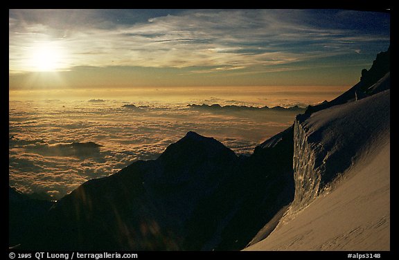 Sun setting over Bionnassay ridge, just under the summit of Mont-Blanc, Italy.  (color)
