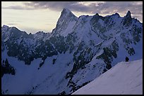 Alpinists go down Aiguille du Midi on a sharp ridge. Alps, France