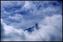 Aiguille du Midi summit emerges from the clouds. Alps, France