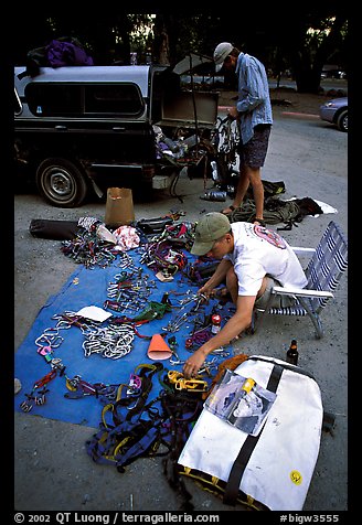 Climbers sort gear for a big-wall climb on the camp 4 parking lot. Yosemite, California (color)