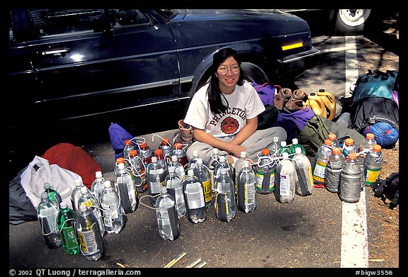 Climber and water bottles needed for an ascent of Mescalito. Yosemite, California (color)