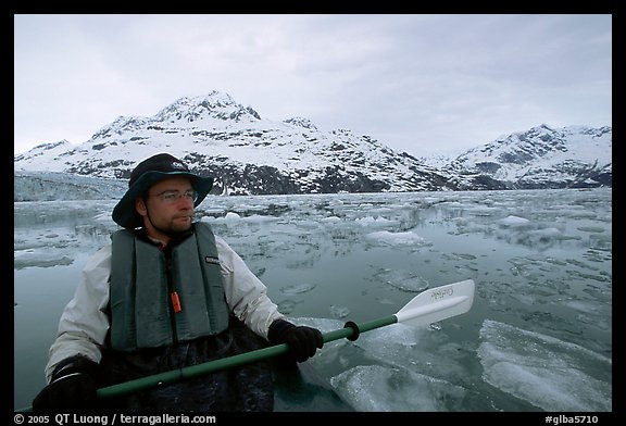 Kayaker on ice-chocked waters close to John Hopkins Inlet. Glacier Bay National Park, Alaska (color)
