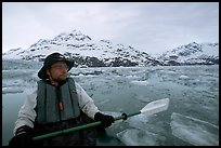 Kayaker on ice-chocked waters close to John Hopkins Inlet. Glacier Bay National Park, Alaska (color)