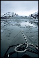 Kayaks prow, floating icebergs, and glacier. Glacier Bay National Park, Alaska ( color)