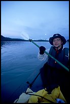 Kayaker paddling in Muir Inlet at midnight. Glacier Bay National Park, Alaska ( color)