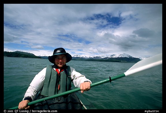 Kayaker paddling in Muir Inlet. Glacier Bay National Park, Alaska