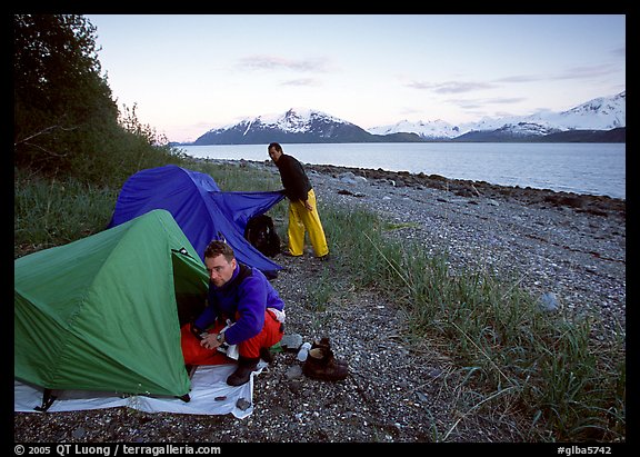 Kayakers getting into their tents for the night,  East Arm. Glacier Bay National Park, Alaska (color)