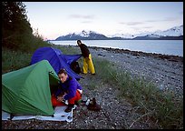 Kayakers getting into their tents for the night,  East Arm. Glacier Bay National Park, Alaska ( color)