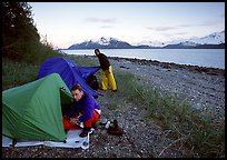 Kayakers getting into their tents for the night,  East Arm. Glacier Bay National Park, Alaska