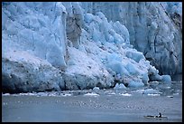 Kayaker bellow  the front of Lamplugh Glacier. Glacier Bay National Park, Alaska ( color)