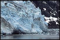 Kayaker paddling bellow Lamplugh Glacier. Glacier Bay National Park, Alaska (color)