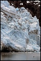 Kayaker dwarfed by Lamplugh Glacier. Glacier Bay National Park, Alaska ( color)