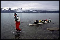 Kayaker towing kayak, East arm. Glacier Bay National Park, Alaska ( color)