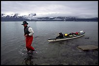 Kayaker towing kayak, East arm. Glacier Bay National Park, Alaska ( color)