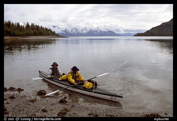 Kayakers land in Hugh Miller Inlet. Glacier Bay National Park, Alaska (color)