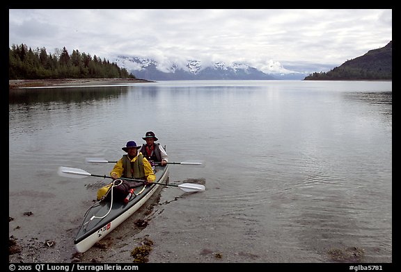 Kayakers land in Hugh Miller Inlet. Glacier Bay National Park, Alaska (color)