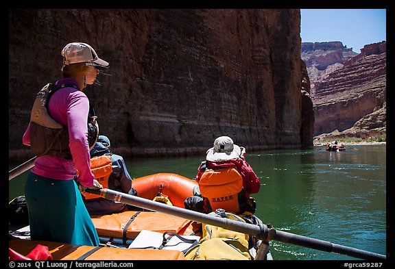 On raft passing below redwall limestone cliff. Grand Canyon National Park, Arizona (color)