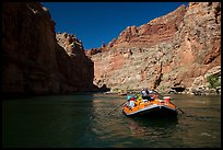 Paddling calm stretch of Colorado River beneath towering walls. Grand Canyon National Park, Arizona