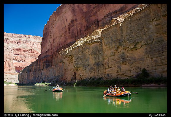 Rafts against sheer redwall canyon wall. Grand Canyon National Park, Arizona