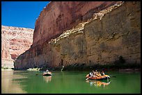 Rafts against sheer redwall canyon wall. Grand Canyon National Park, Arizona