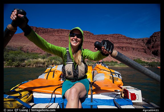 Woman paddling oar-powered raft. Grand Canyon National Park, Arizona (color)