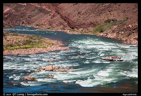 Motor-powered raft navigating Hance Rapids. Grand Canyon National Park, Arizona