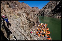 Scrambling on rocks towards rafts at the month of Clear Creek canyon. Grand Canyon National Park, Arizona ( color)
