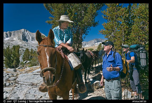 Horseman speaking with hikers, Dusy Basin. Kings Canyon National Park, California