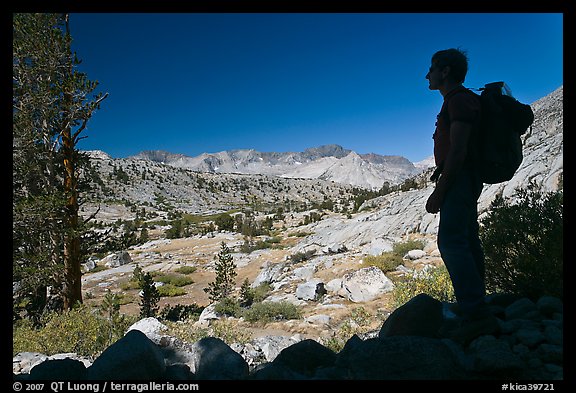 Hiker silhouetted, lower Dusy Basin. Kings Canyon National Park, California (color)