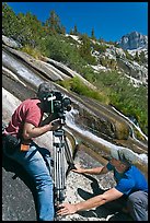 Men filming a waterfall, lower Dusy Basin. Kings Canyon National Park, California (color)