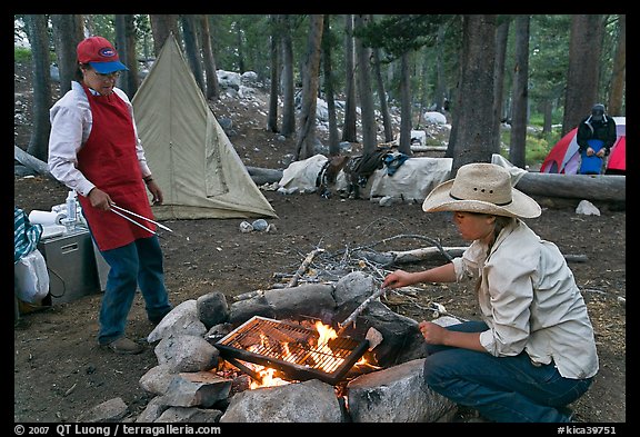 Women preparing food at camp, Le Conte Canyon. Kings Canyon National Park, California (color)