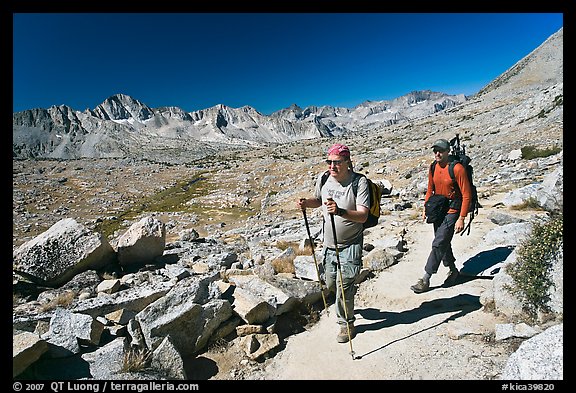 Hikers on trail below Biship Pass, Dusy Basin. Kings Canyon National Park, California